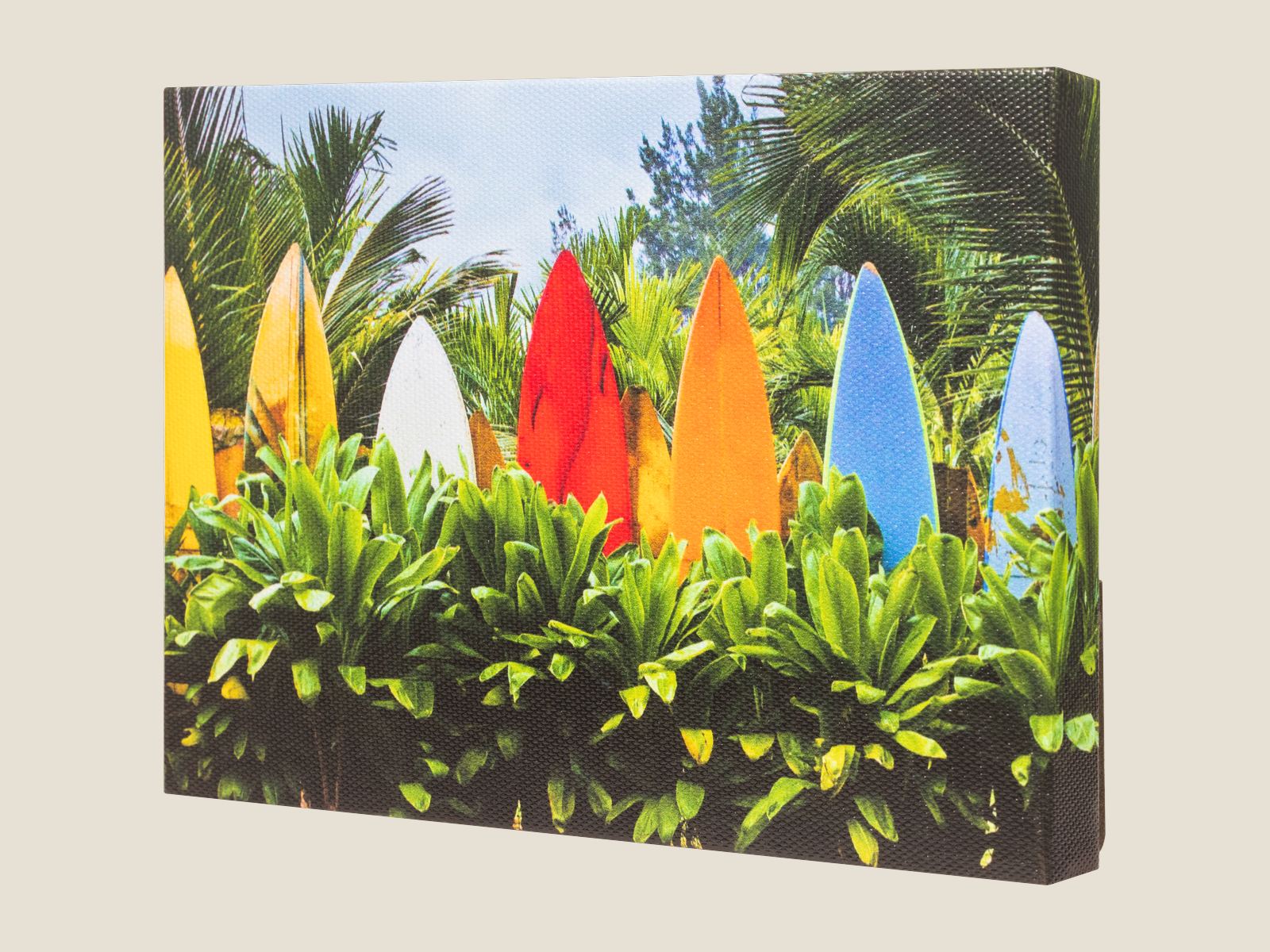 A gallery-wrapped desktop canvas of colorful surfboards