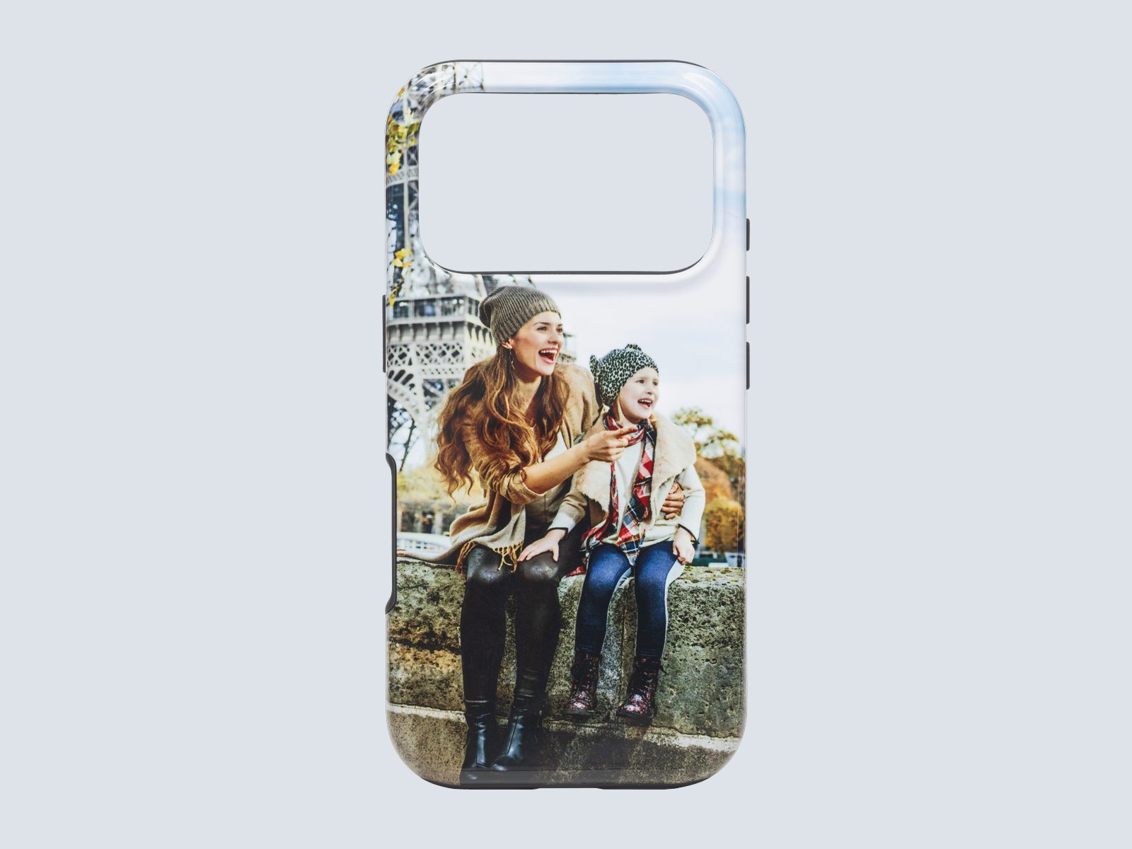 A tough phone case printed with a mother and daughter laughing outdoors